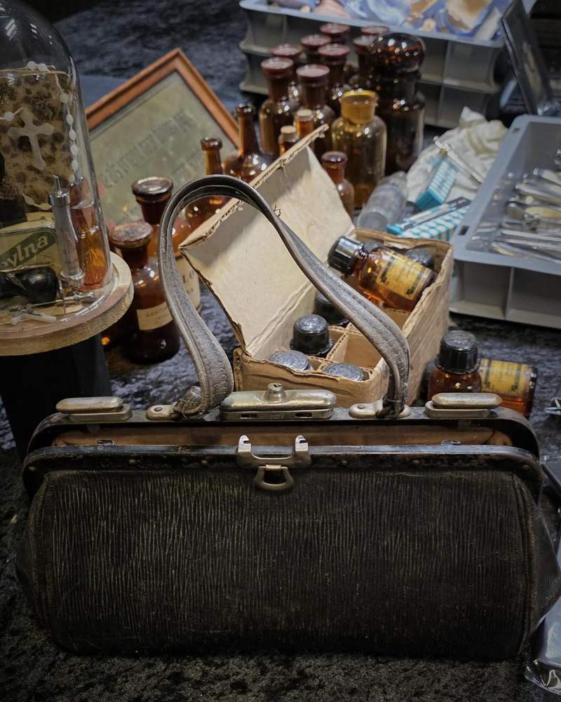 Antique leather doctor’s bag with bottles